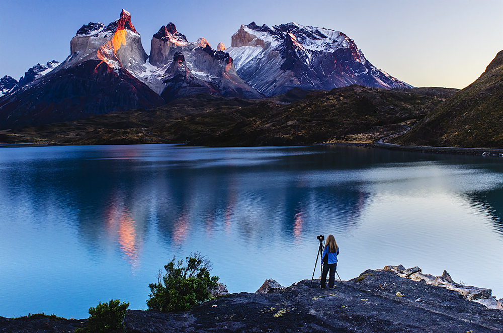 A photographer photographing the peaks and spires of Torres del Paine