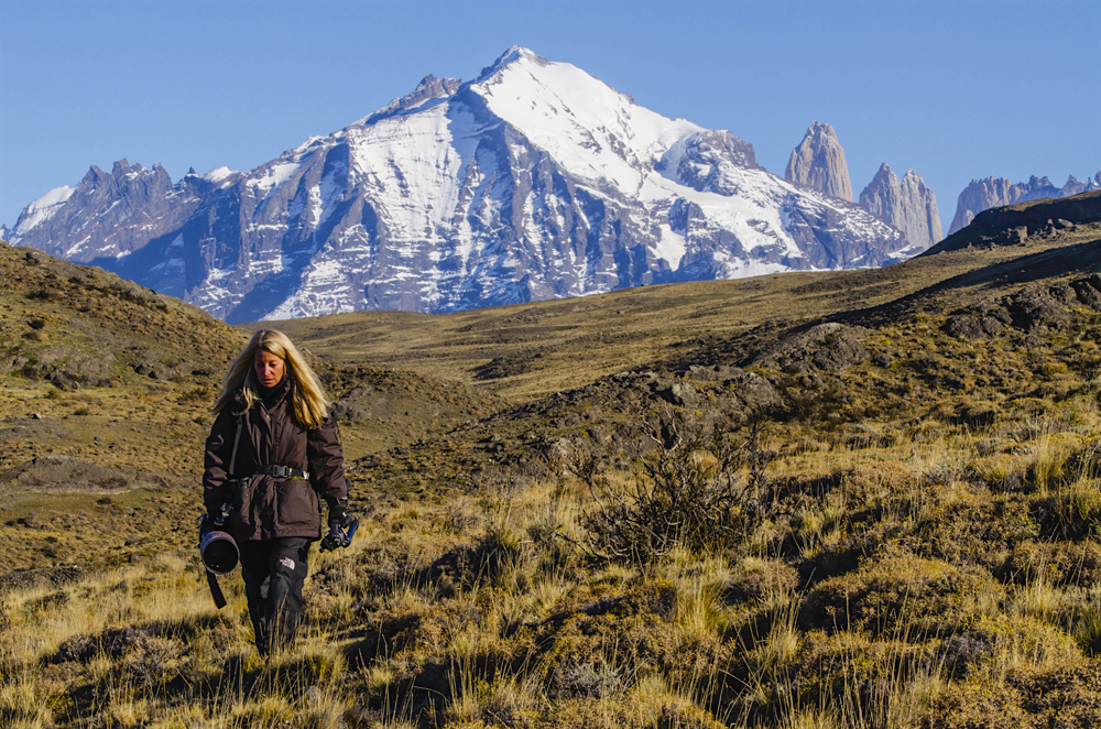 A photographer hiking in search of wild pumas in Torres del Paine
