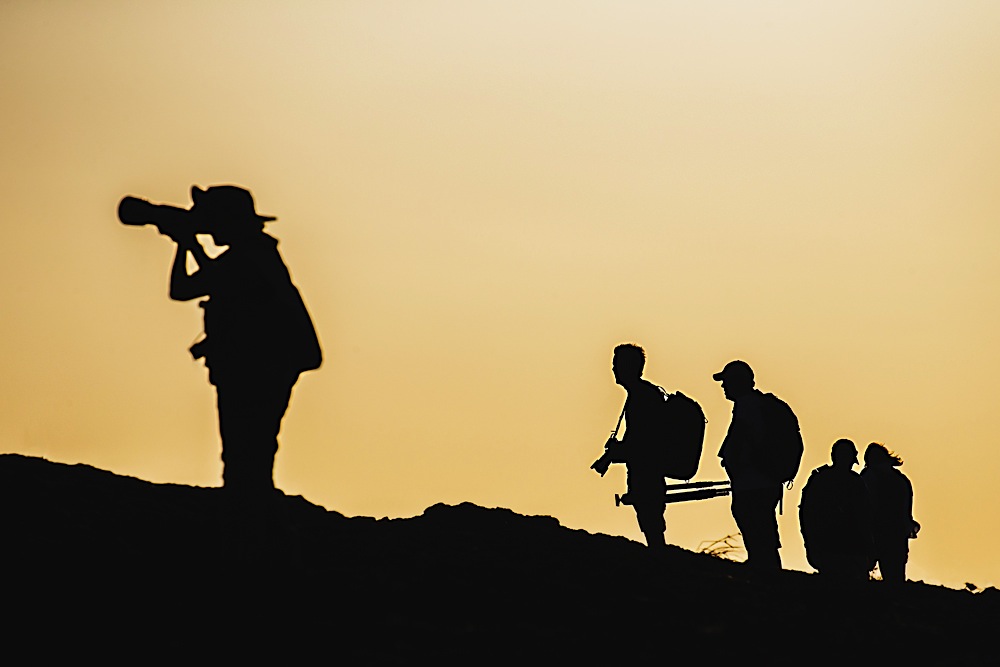 Silhouette of photographers and tourists in the Galapagos