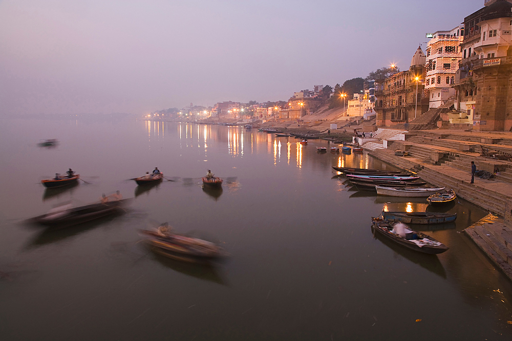 Boats on the Ganges River near the Ghats (stairs) at dawn